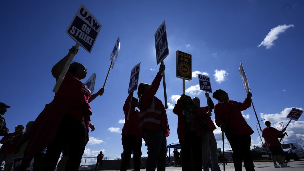 United Auto Workers members walk the picket line.