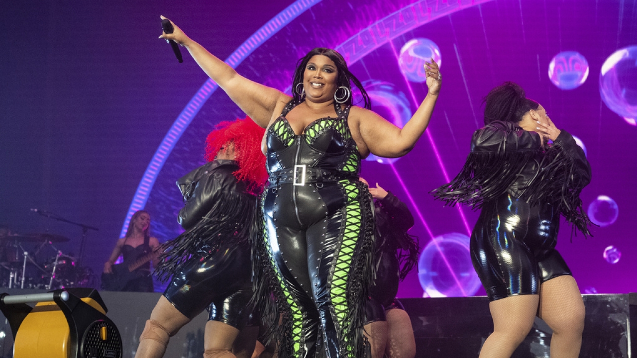 Lizzo appears on stage.