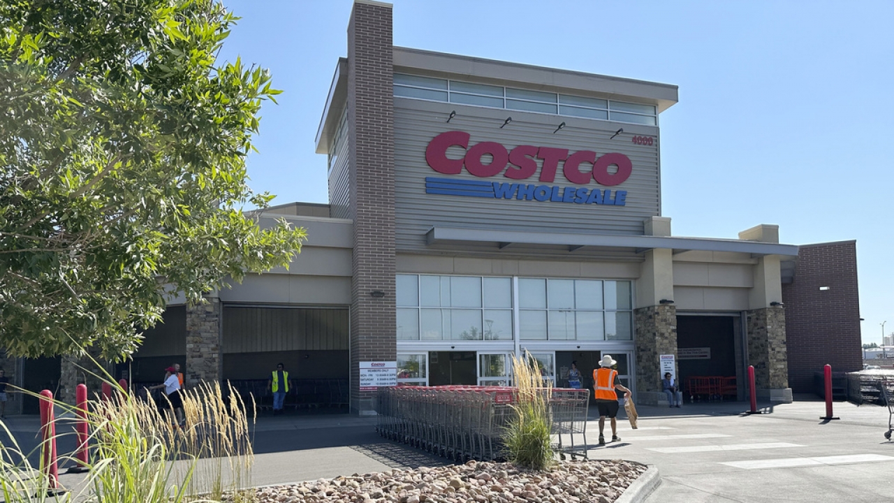 A worker heads into a Costco warehouse in Sheridan, Colorado.