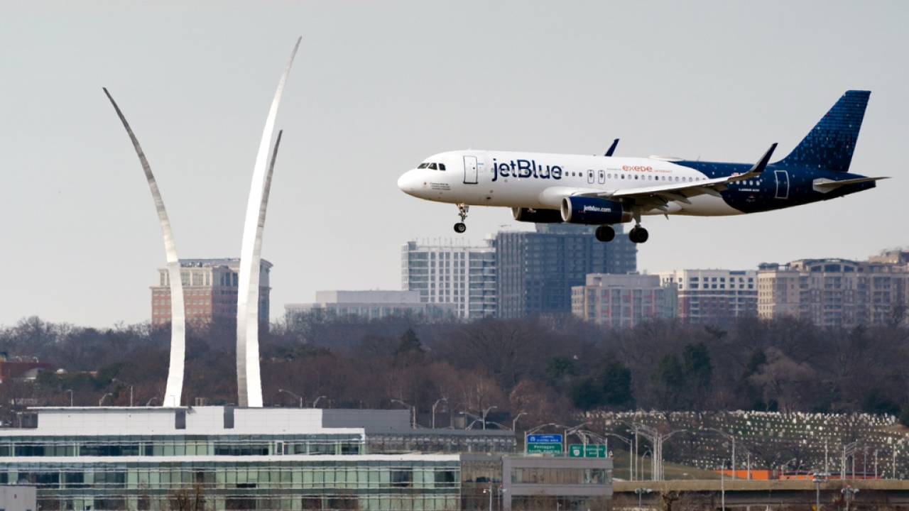 A JetBlue flight lands.