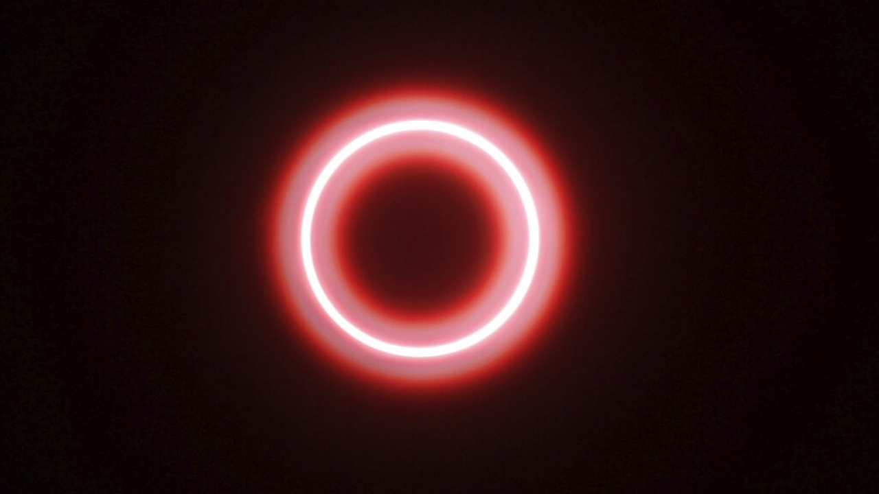A solar eclipse in which the the moon moves directly in front of the sun, but the outer ring of the sun is still visible.
