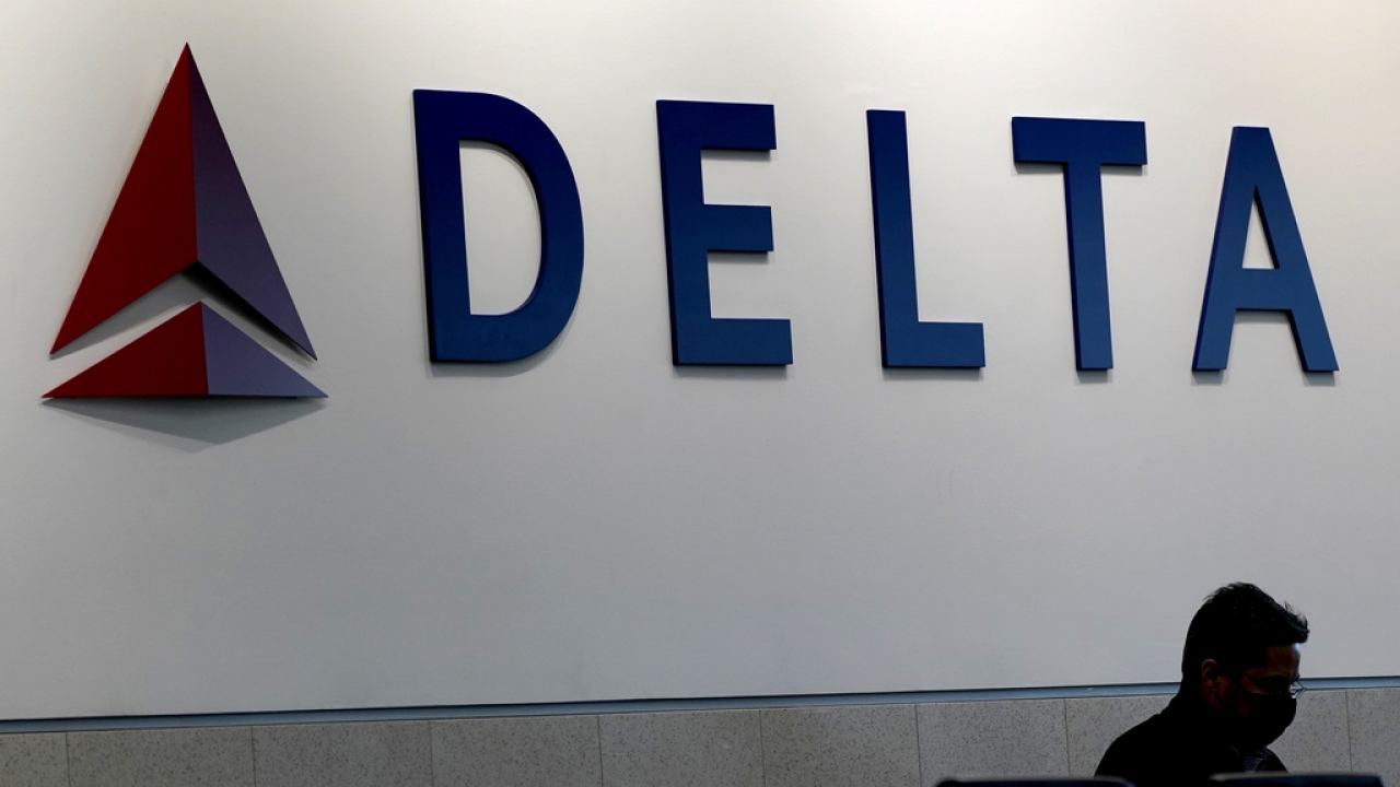 A man waits for a Delta Airlines flight at Hartsfield-Jackson International Airport in Atlanta.