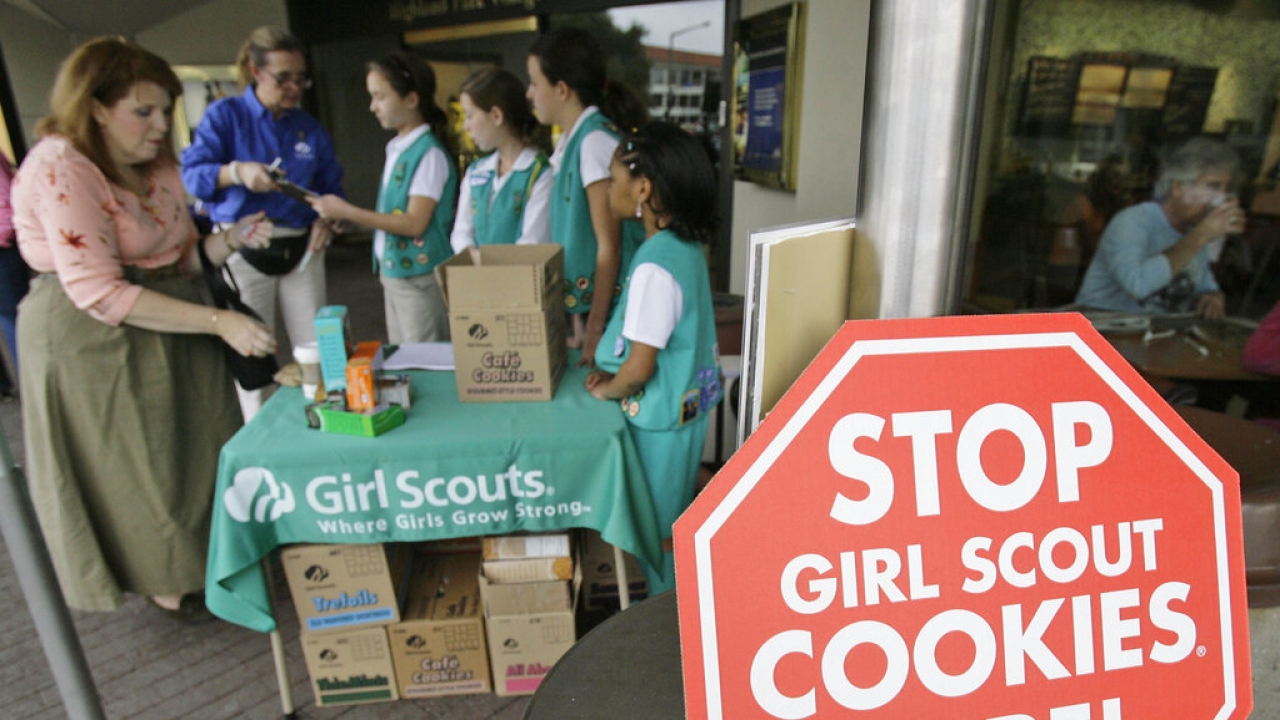 Girl Scouts from the Texas Council sell cookies.