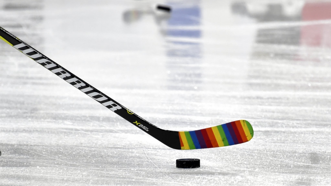 A Vegas Golden Knights player uses rainbow tape on his stick during warmups before an NHL hockey game.