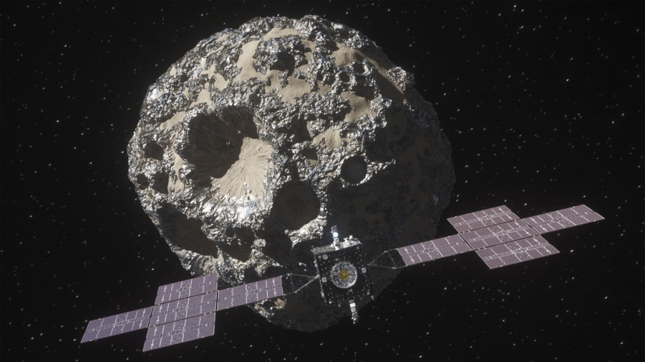 The spacecraft Psyche approaching the asteroid Psyche.