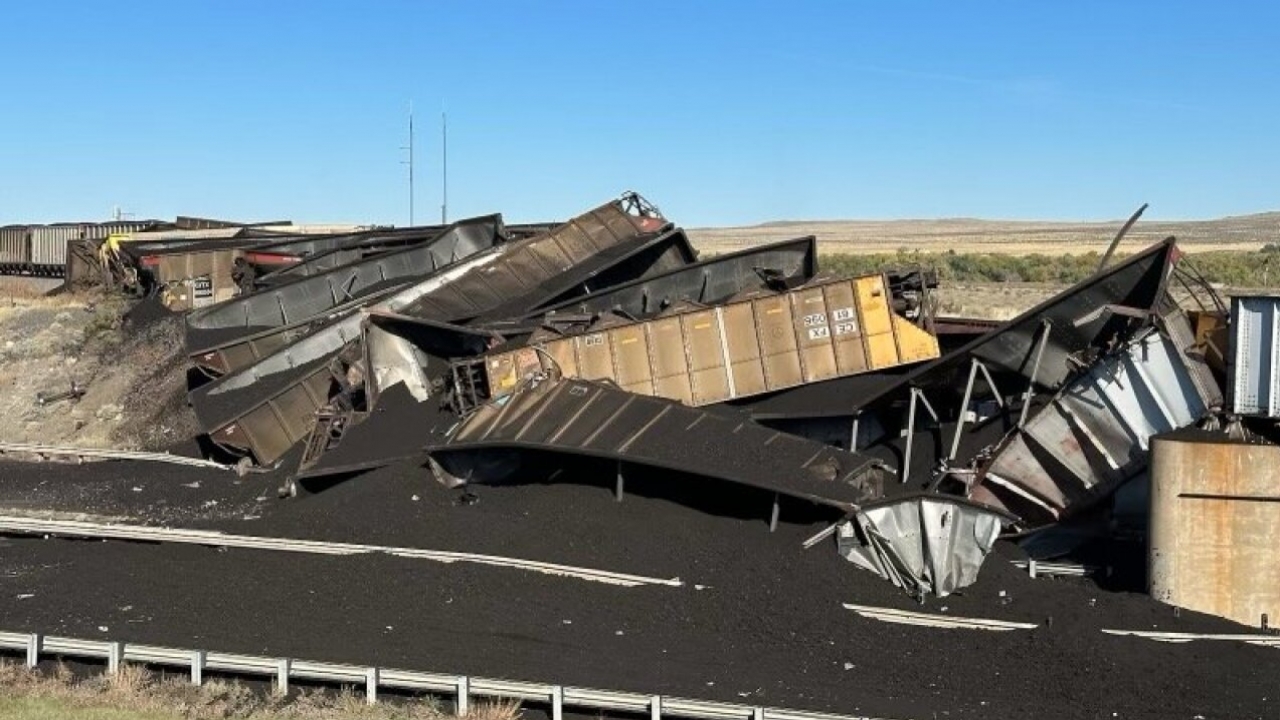 Mangled train cars scattered on a Colorado interstate.