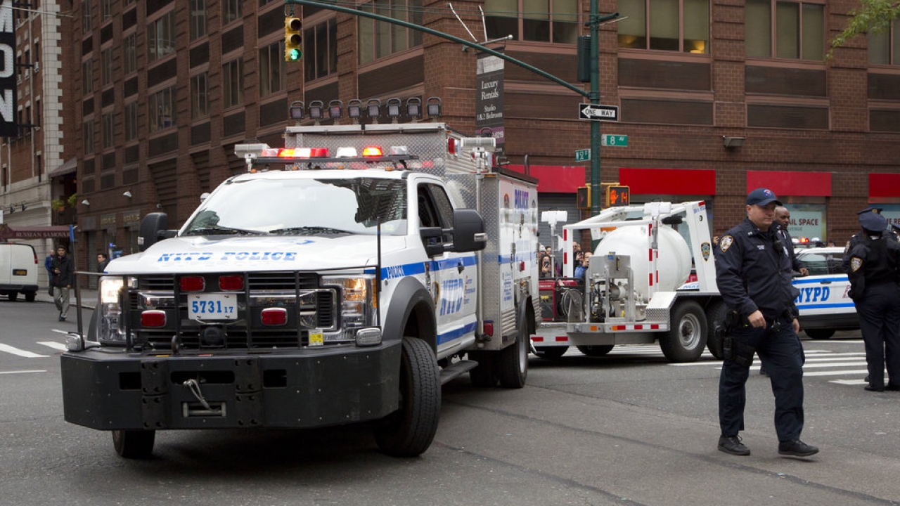 A New York Police Department tow truck is shown.