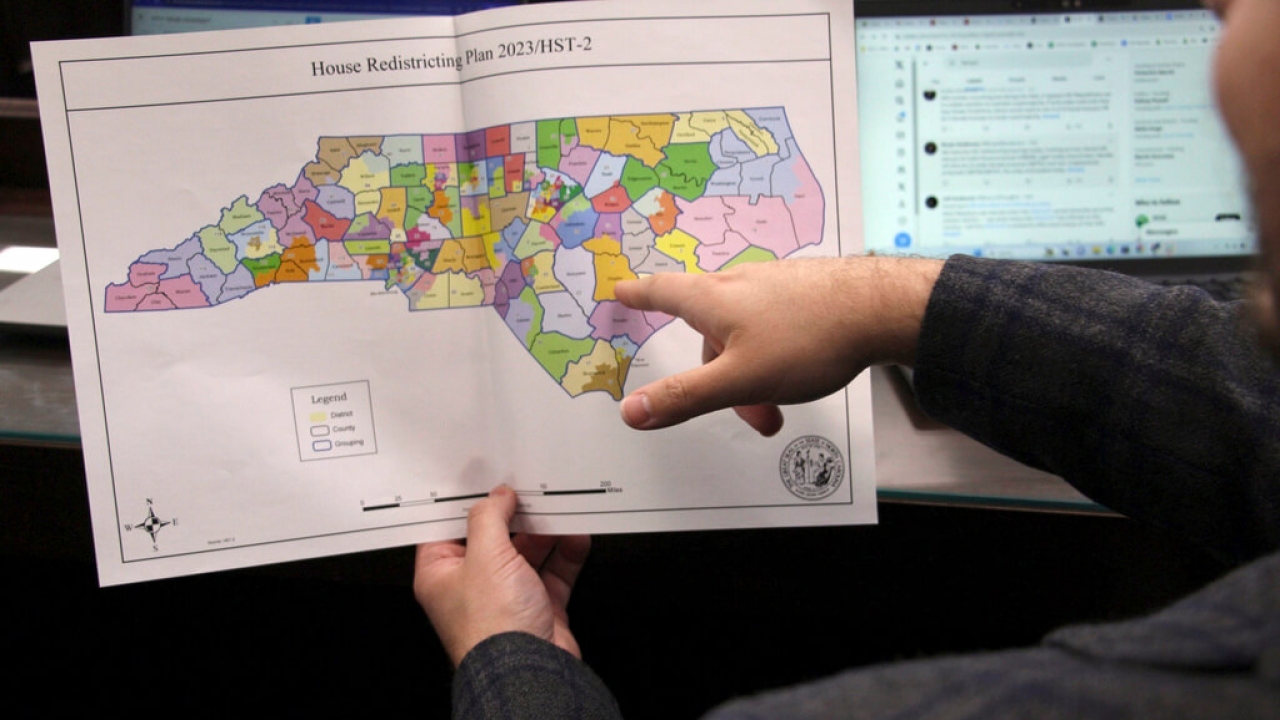 The North Carolina state House reviews copies of a map proposal.