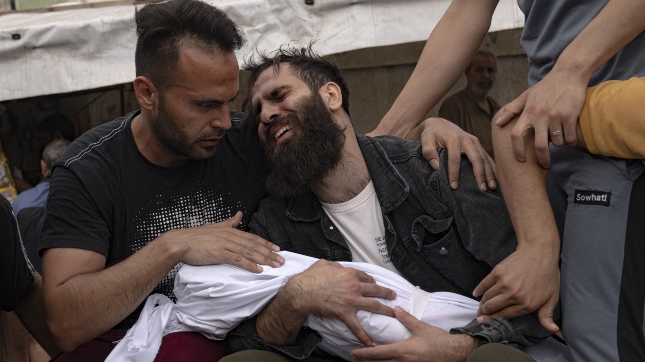 Palestinians mourn their relatives killed in the Israeli bombardment.