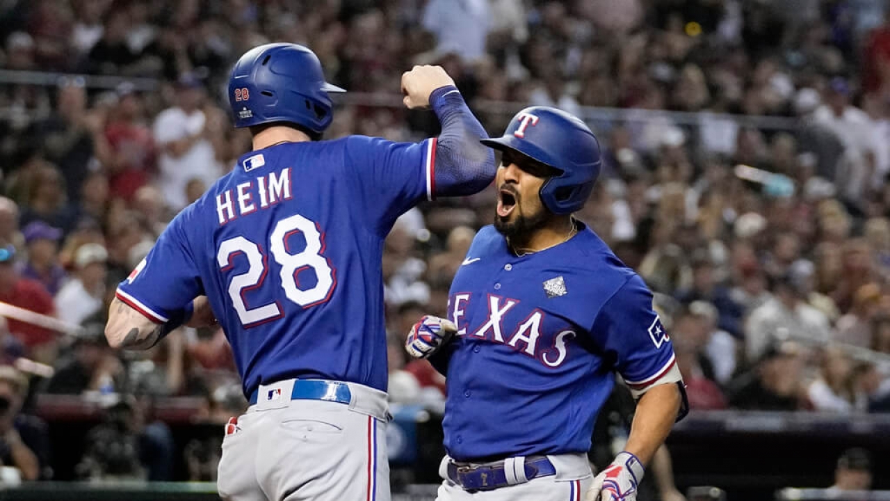 Texas Rangers' Marcus Semien celebrates a two-run home run with Jonah Heim