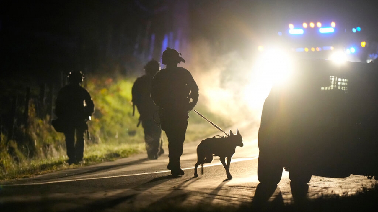A member of law enforcement with a police dog in Bowdoin, Maine