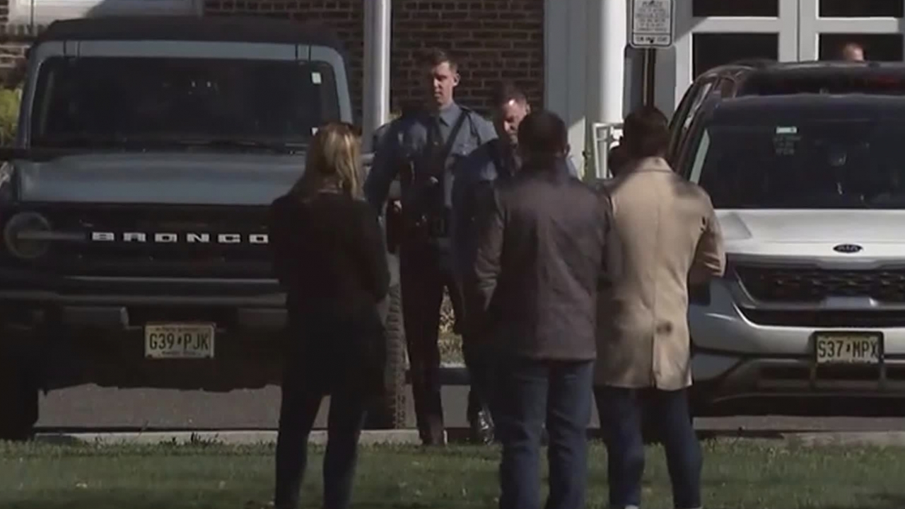 Police outside of Elizabeth Moore School in New Jersey after a school janitor was arrested