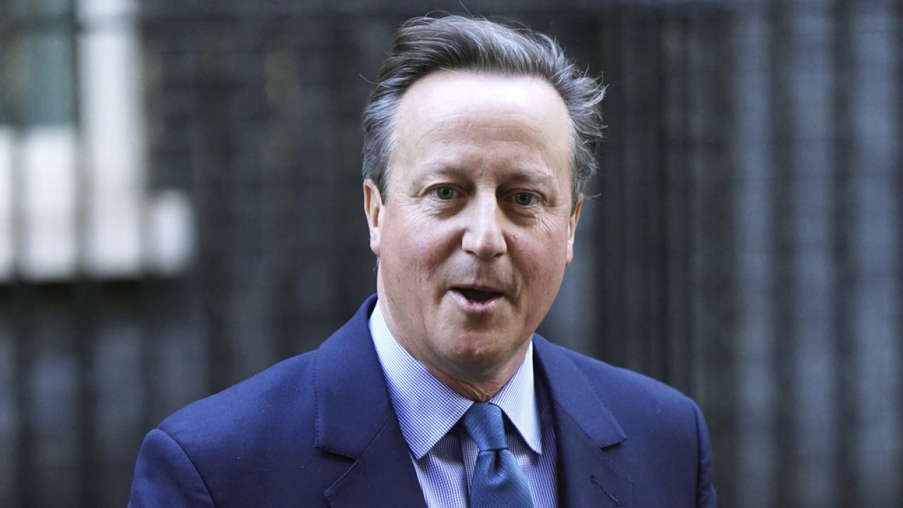 Britain's former prime minister David Cameron leaves Downing Street, in London.
