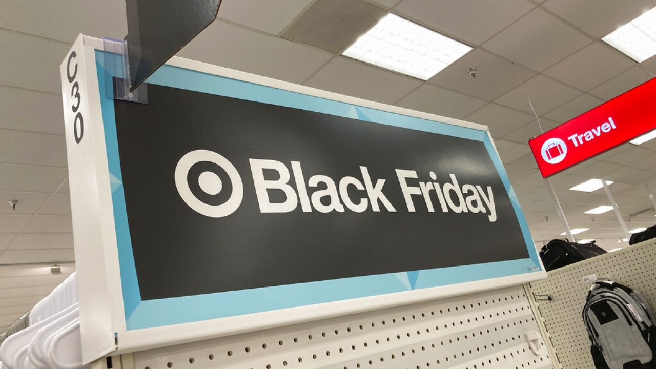 A sign calls shoppers' attention to specials offered at Black Friday prices in a Target store.