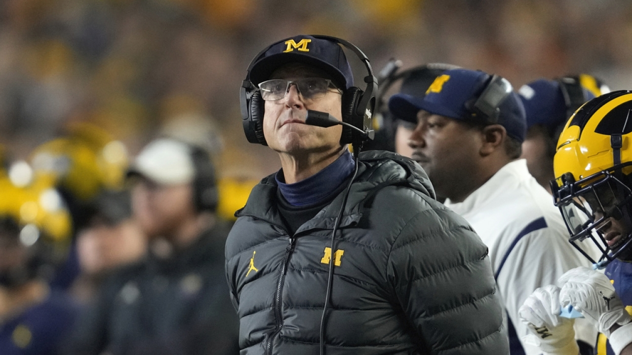 University of Michigan head football coach Jim Harbaugh on the sidelines during a game.