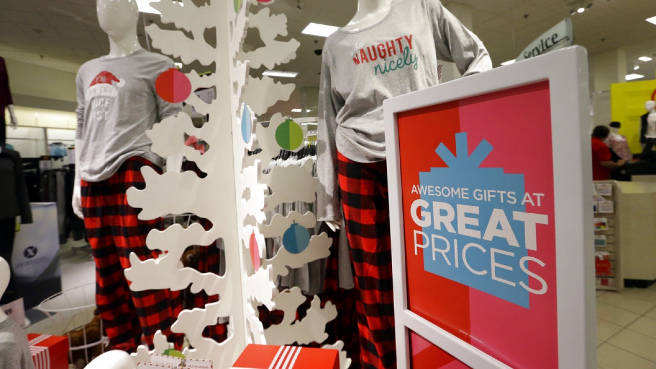 A holiday sale display greets shoppers entering a JCPenney store.