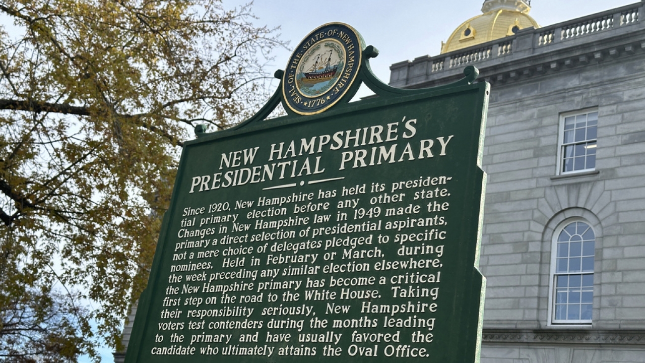 A historical marker displayed outside the Statehouse in Concord, New Hampshire.
