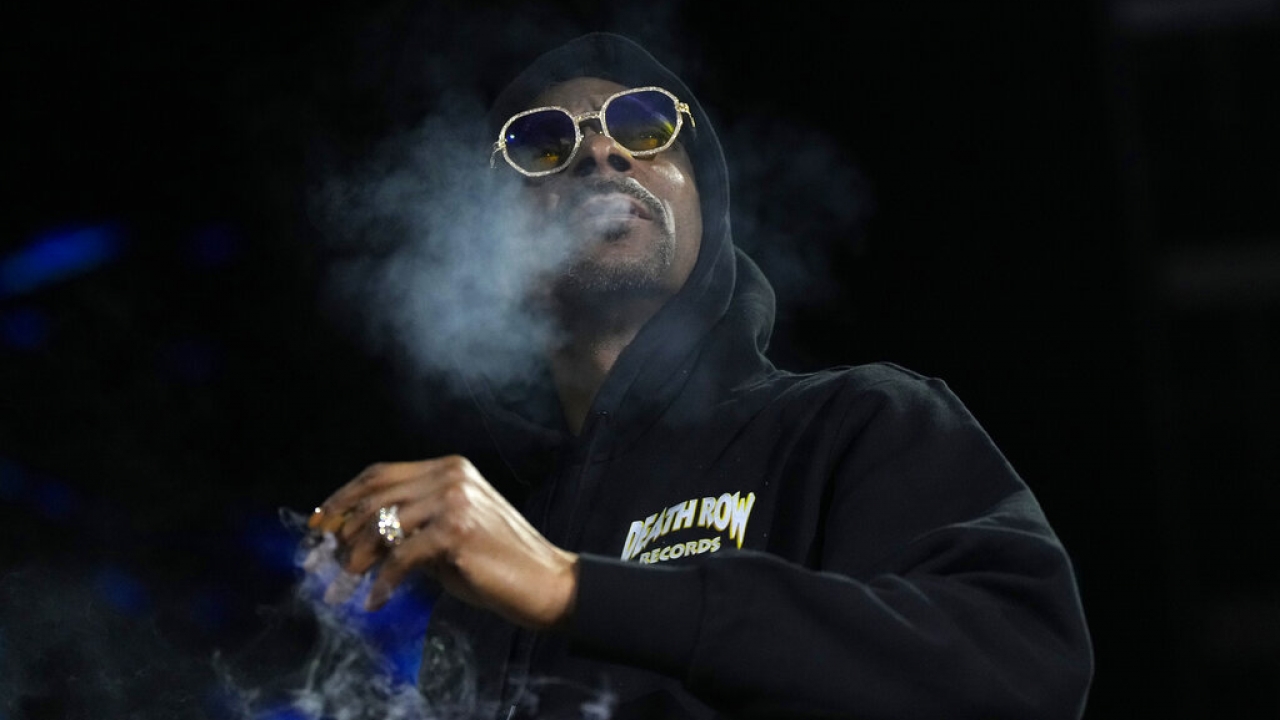 Snoop Dogg smokes weed.