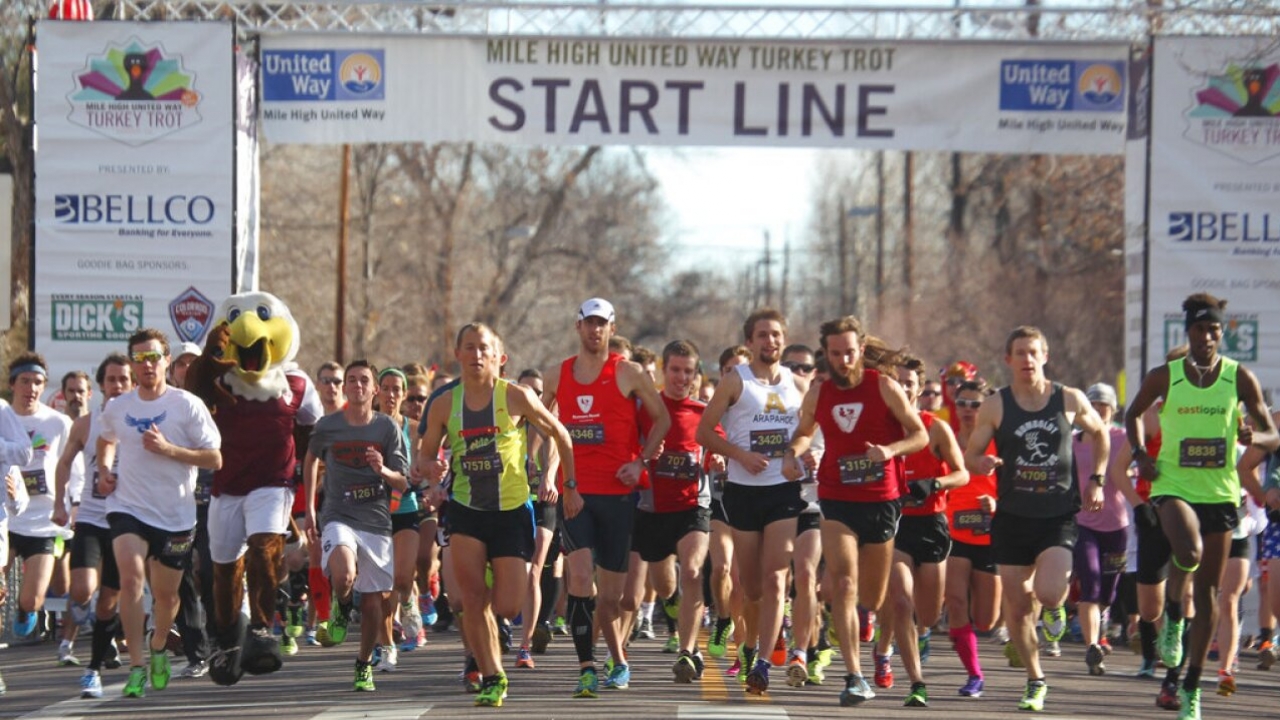 Runners break from the starting line at the 40th annual Turkey Trot to raise money for the Denver chapter of the United Way.