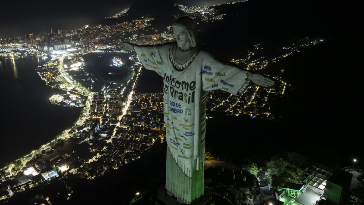 The Christ the Redeemer statue is illuminated with a welcome message for Taylor Swift.