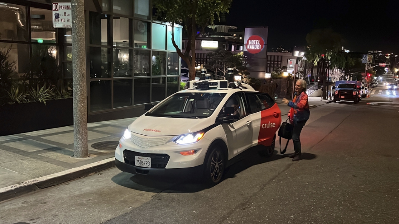 A person gets out of a Cruise driverless taxi after a test ride in San Francisco.