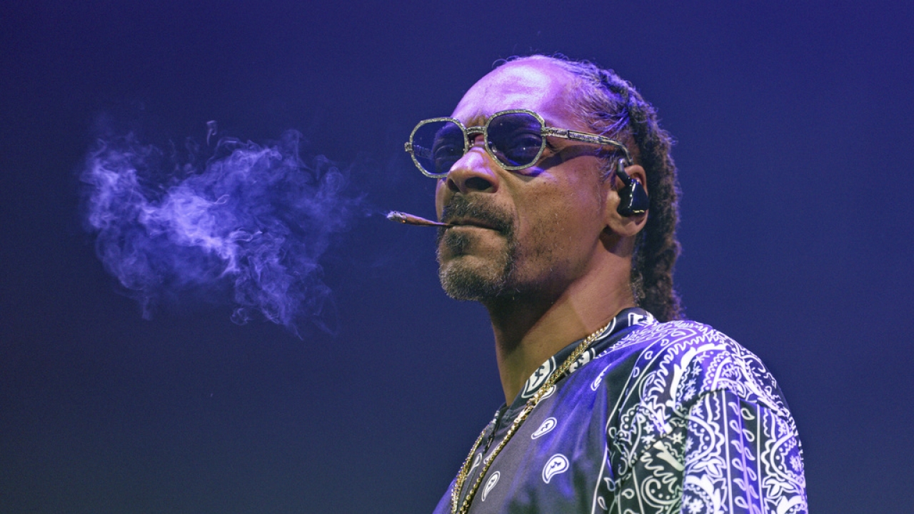 Snoop Dogg is seen smoking.