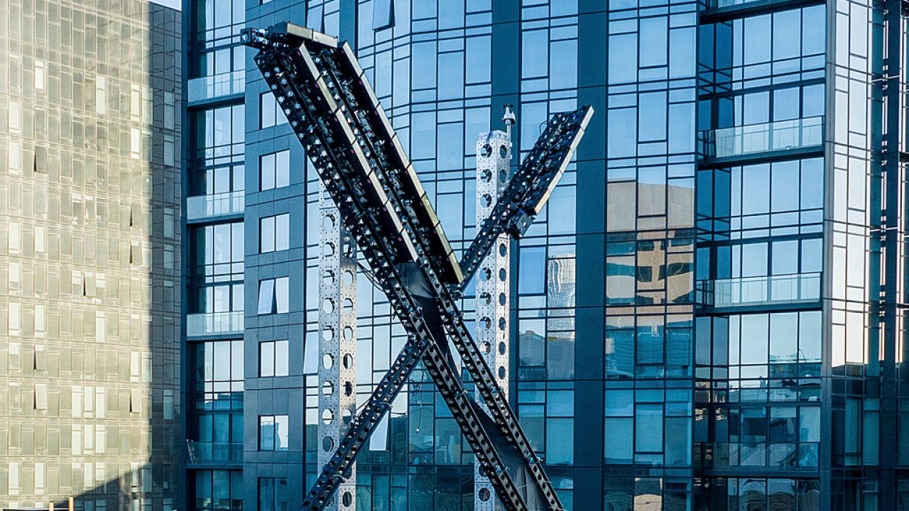 An "X" sign sits atop the social media platform's headquarters