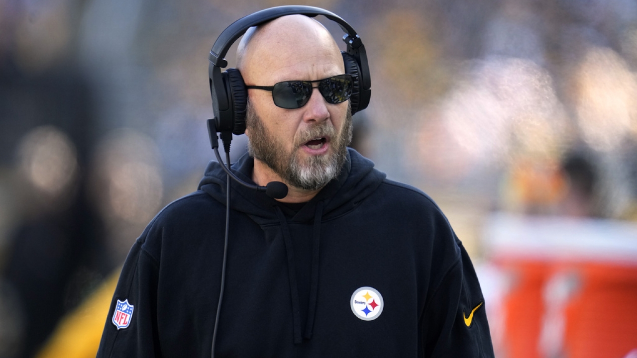 Matt Canada stands on the sidelines during a football game.