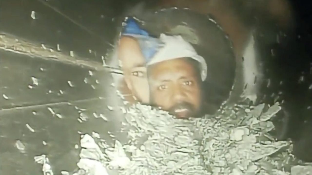 Trapped Indian tunnel workers seen alive for first time since collapse