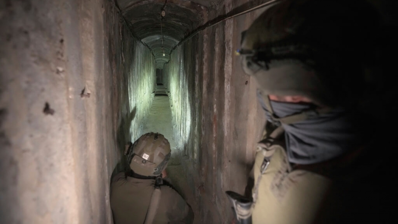 Israeli soldiers show the media an underground tunnel found underneath Shifa Hospital in Gaza City