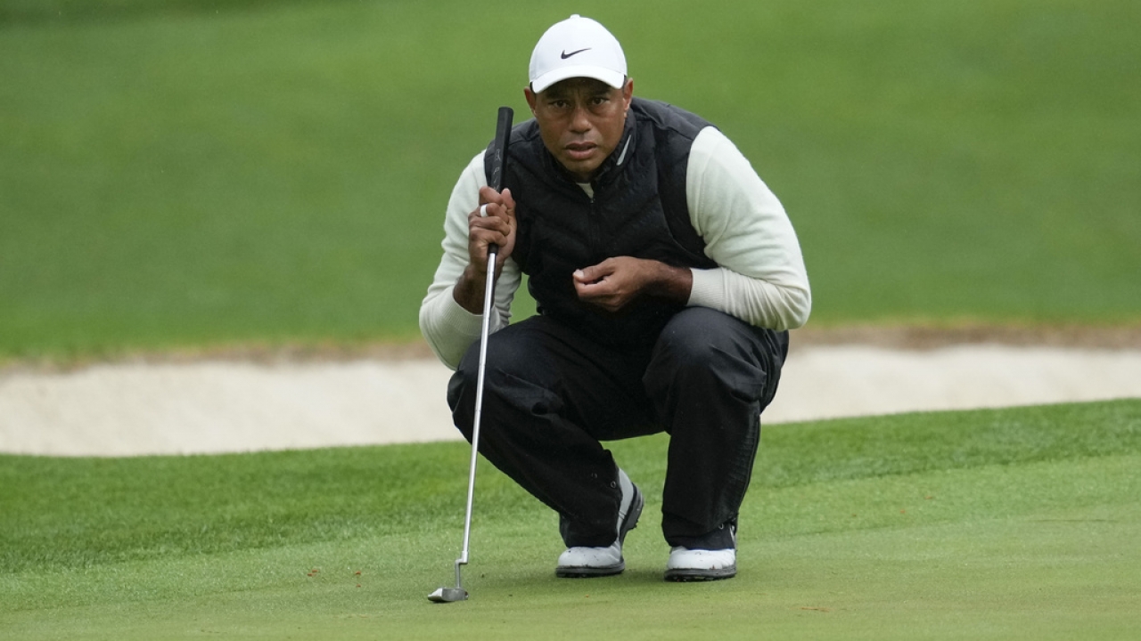 Tiger Woods lines up a putt.