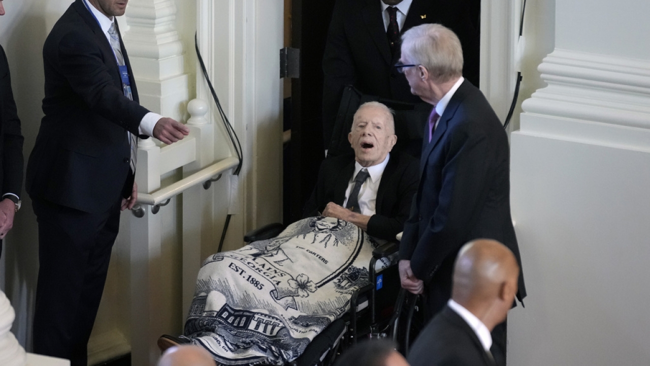 Former President Jimmy Carter arrives to attend a tribute service for his wife and former first lady Rosalynn Carter.