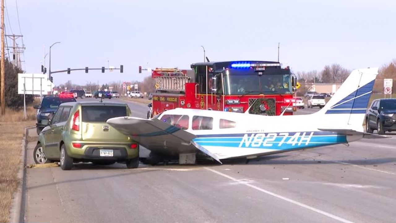 Small plane crashes into car on busy Minnesota highway.