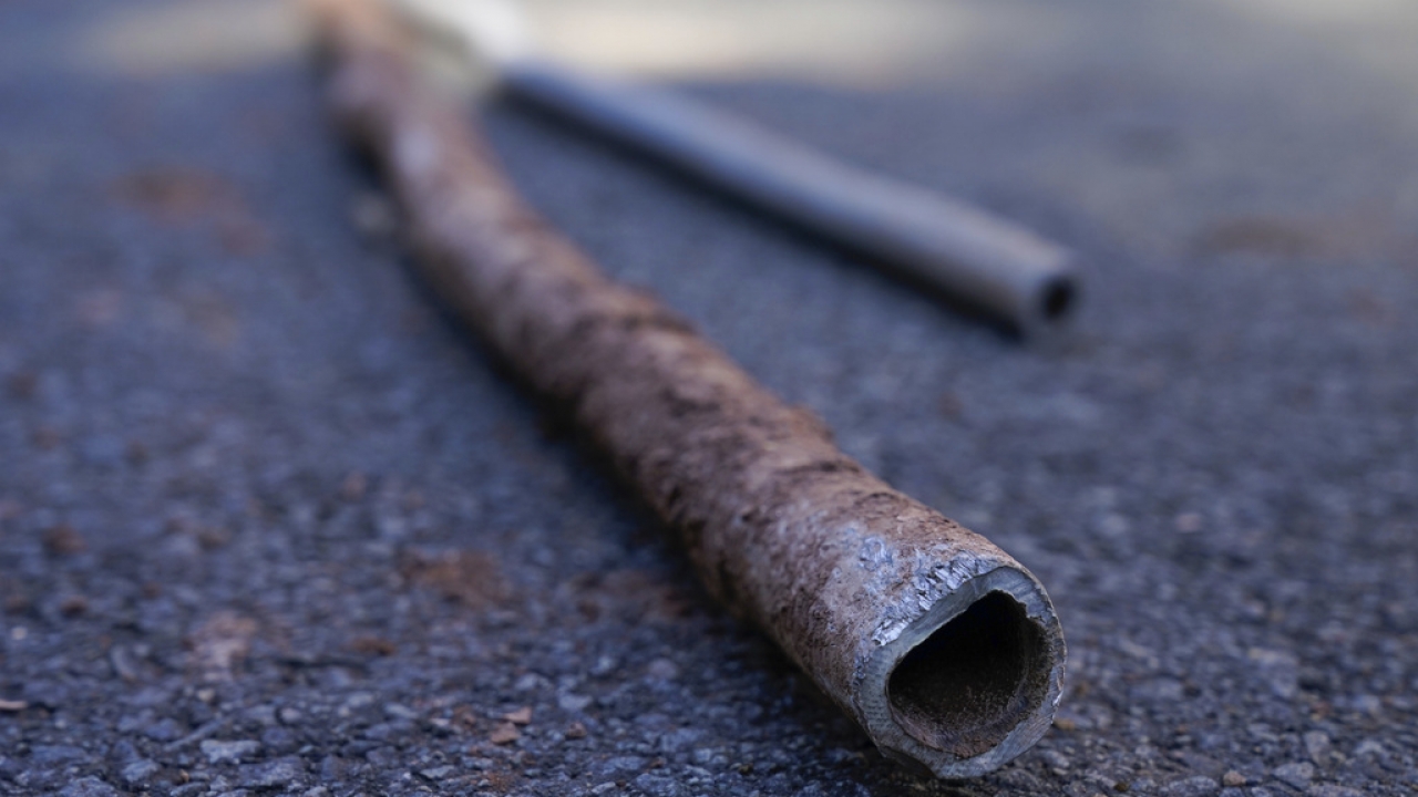 Lead water pipes pulled from underneath the street are seen in Newark, N.J.