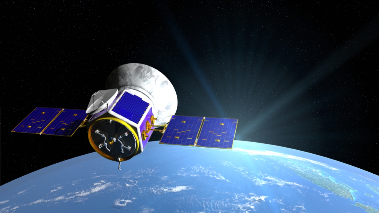 Transiting Exoplanet Survey Satellite over Earth.