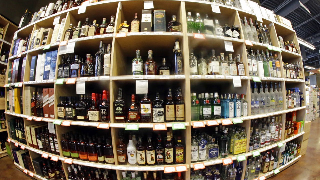 Alcohol on shelves at a store.