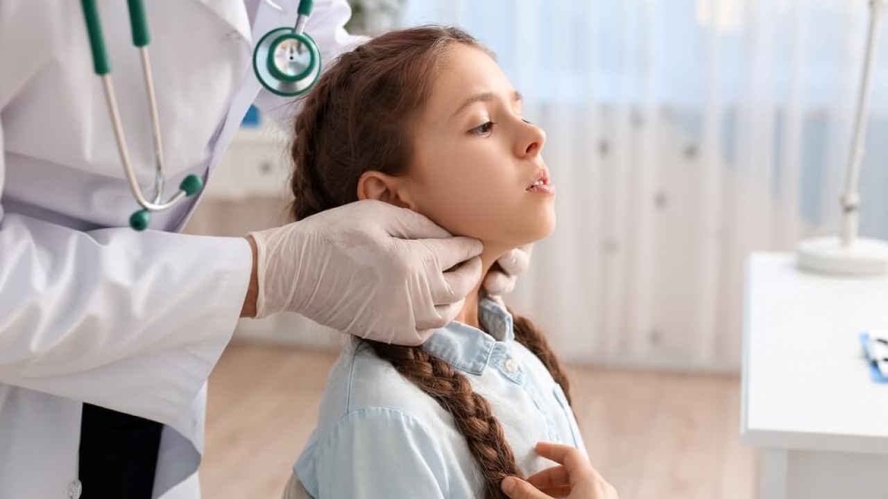 Generic image of a child being treated by a a doctor.