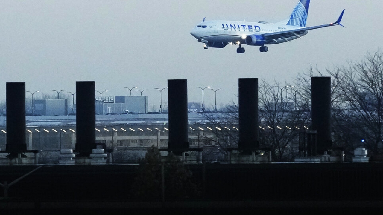A plane lands at a Chicago airport.