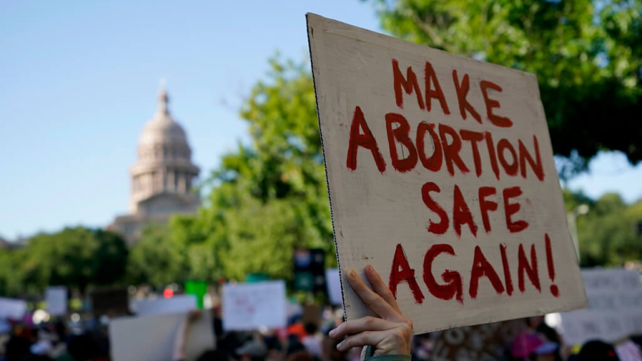 A demonstrator holds a sign supporting abortion rights in Texas