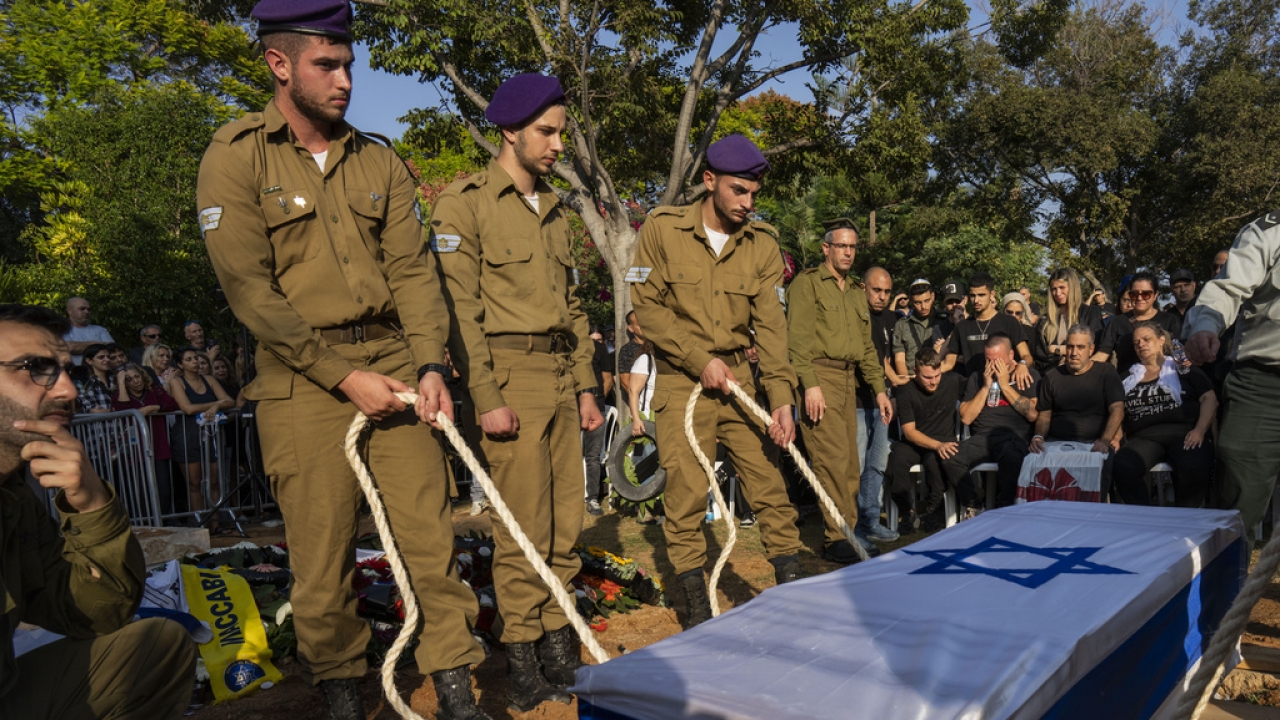 File photo of Israeli soldiers lowering the coffin of a killed Israeli soldier.