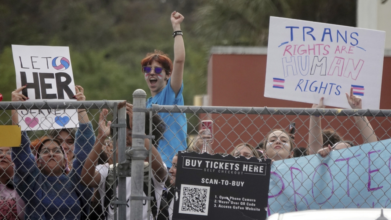 Students from Monarch High School in Coconut Creek, Fla., walk out of the school in support of a transgender athlete.