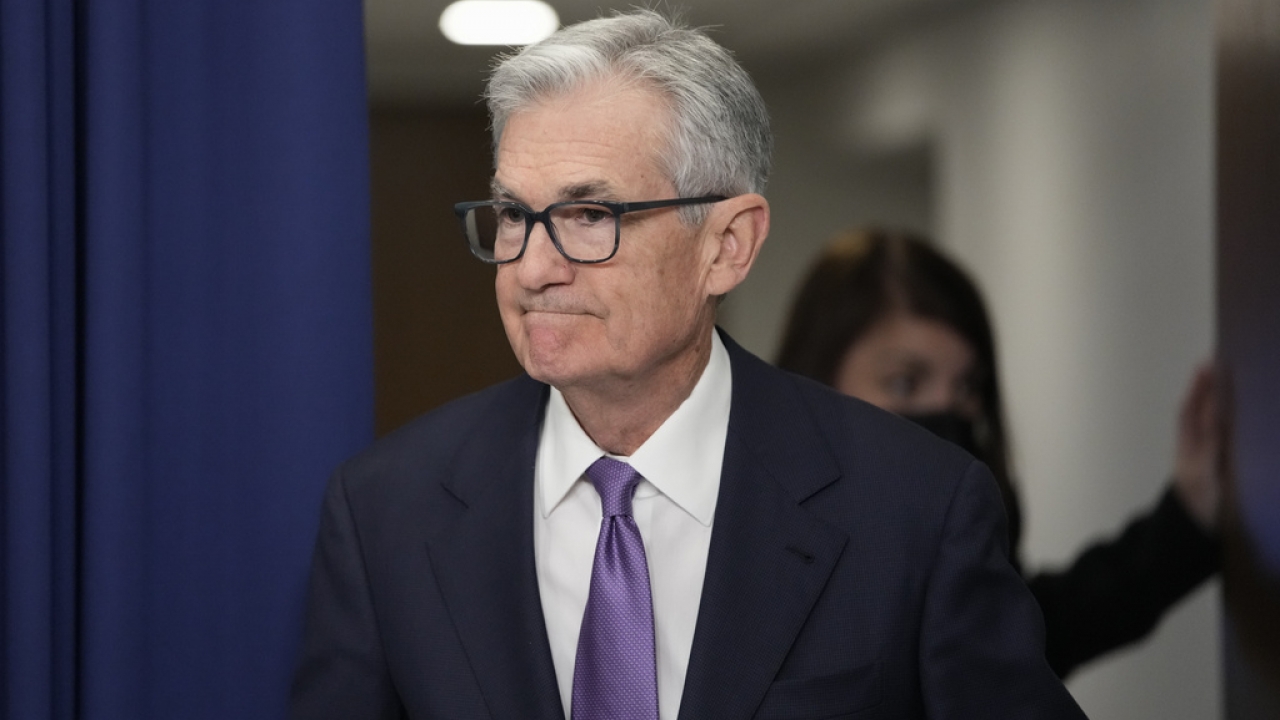 Federal Reserve Board Chair Jerome Powell arrives to speak at a news conference.