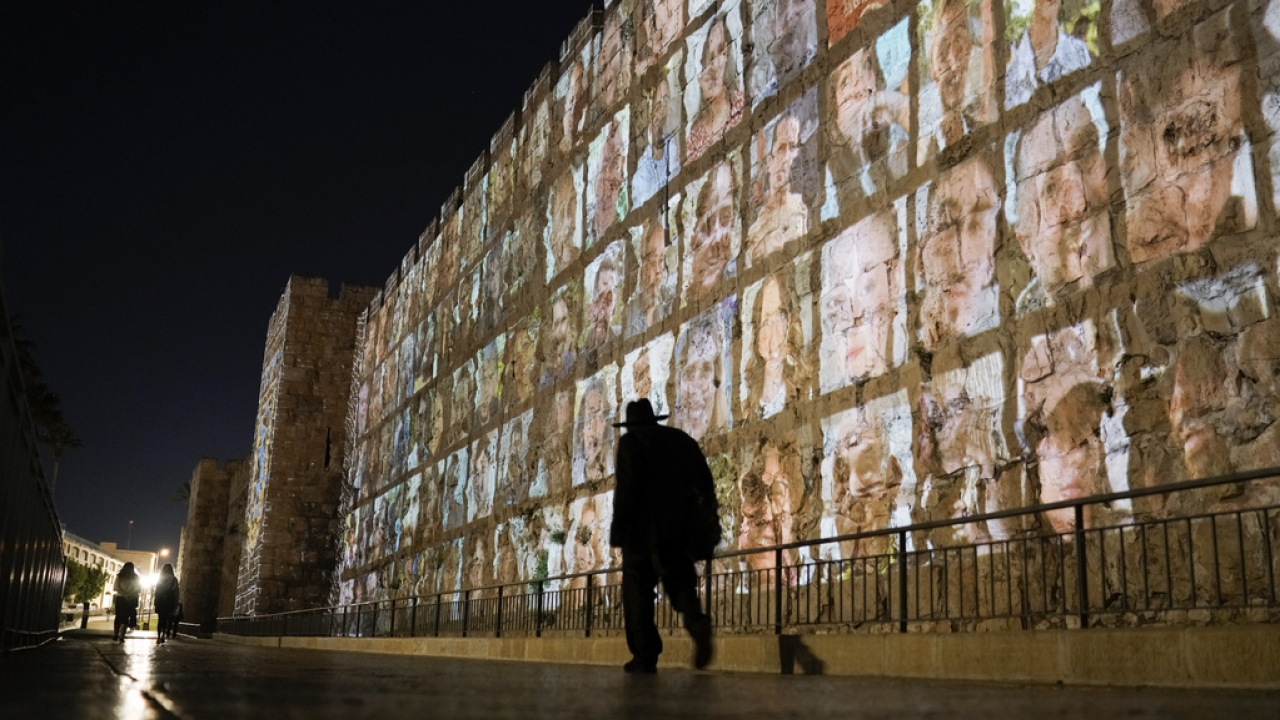 Photographs of Israeli hostages being held by Hamas militants are projected on the walls of Jerusalem's Old City.