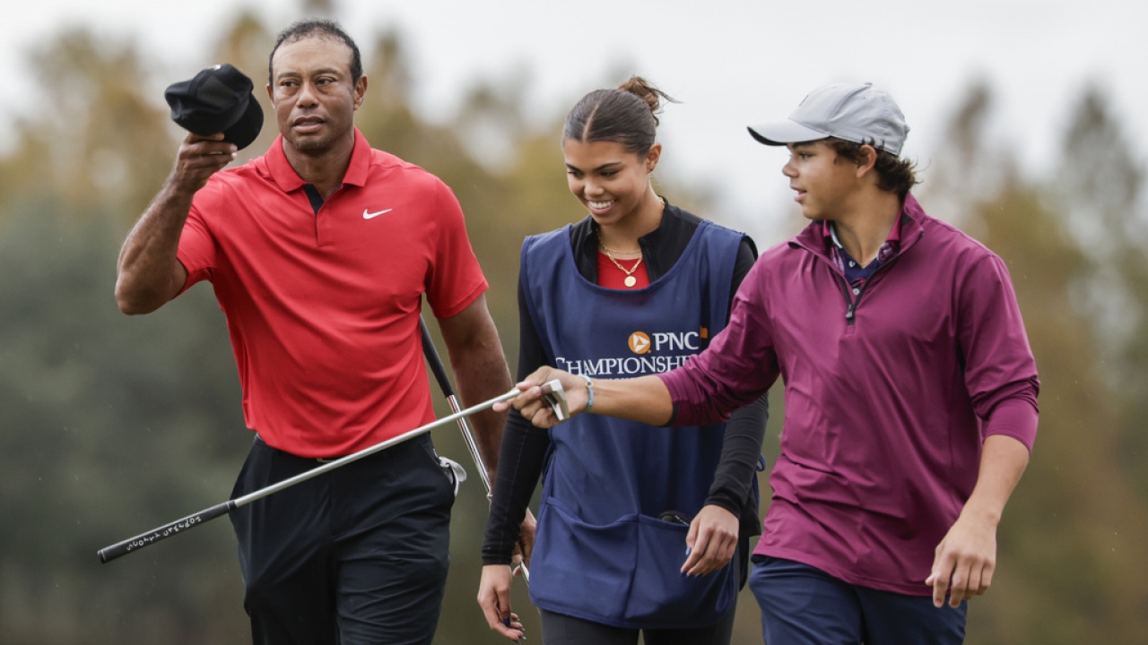 Tiger Woods, left; daughter Sam, center; and son Charlie, right.