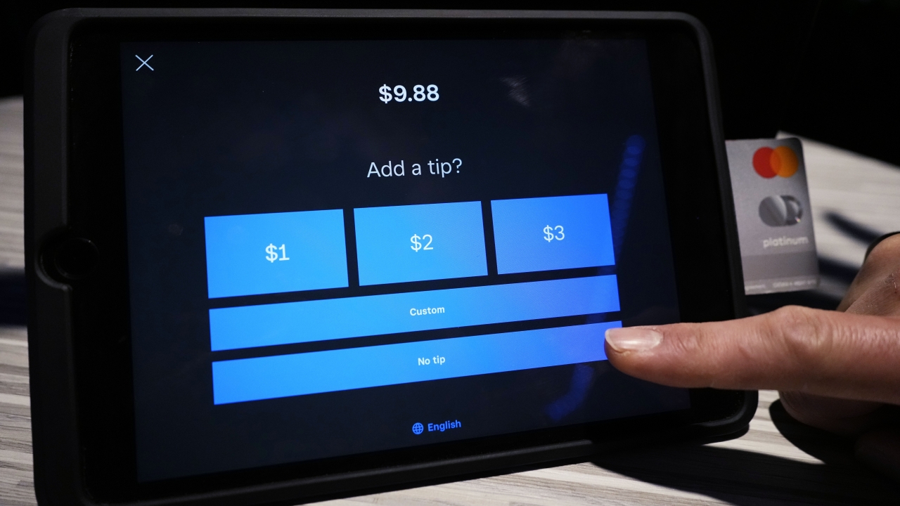 A tipping option is displayed on a card reader tablet at a business in Glenview, Ill., Tuesday, Jan. 10, 2023.