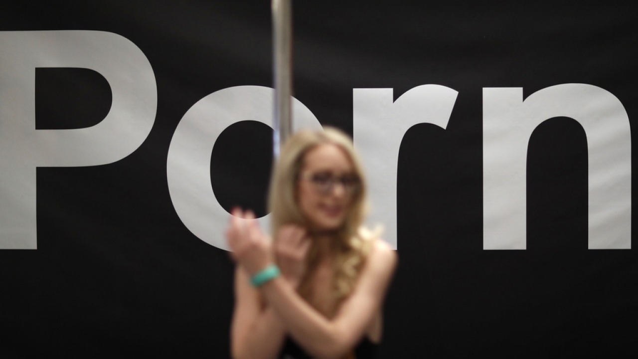 orn actress Ginger Banks stands in the Pornhub booth during the AVN Adult Entertainment Expo