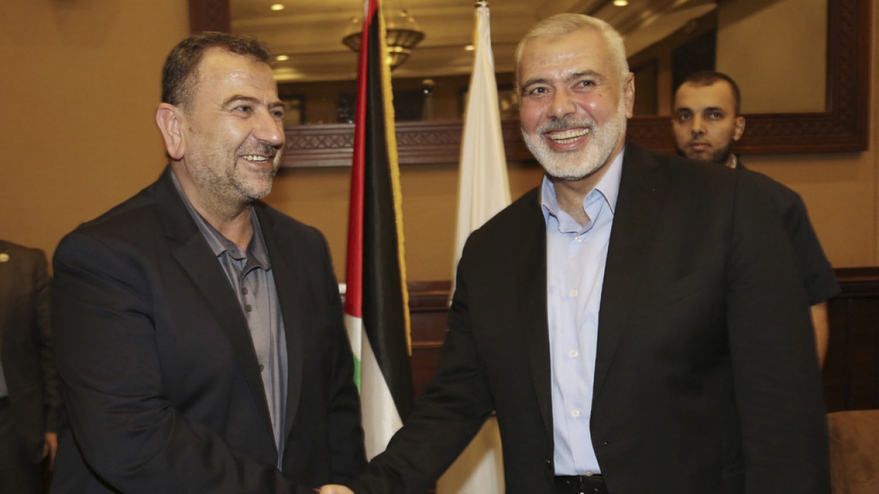 Saleh Arouri, left, a founder of Hamas' military wing, shakes hands with Ismail Haniyeh, head of the Hamas political bureau.