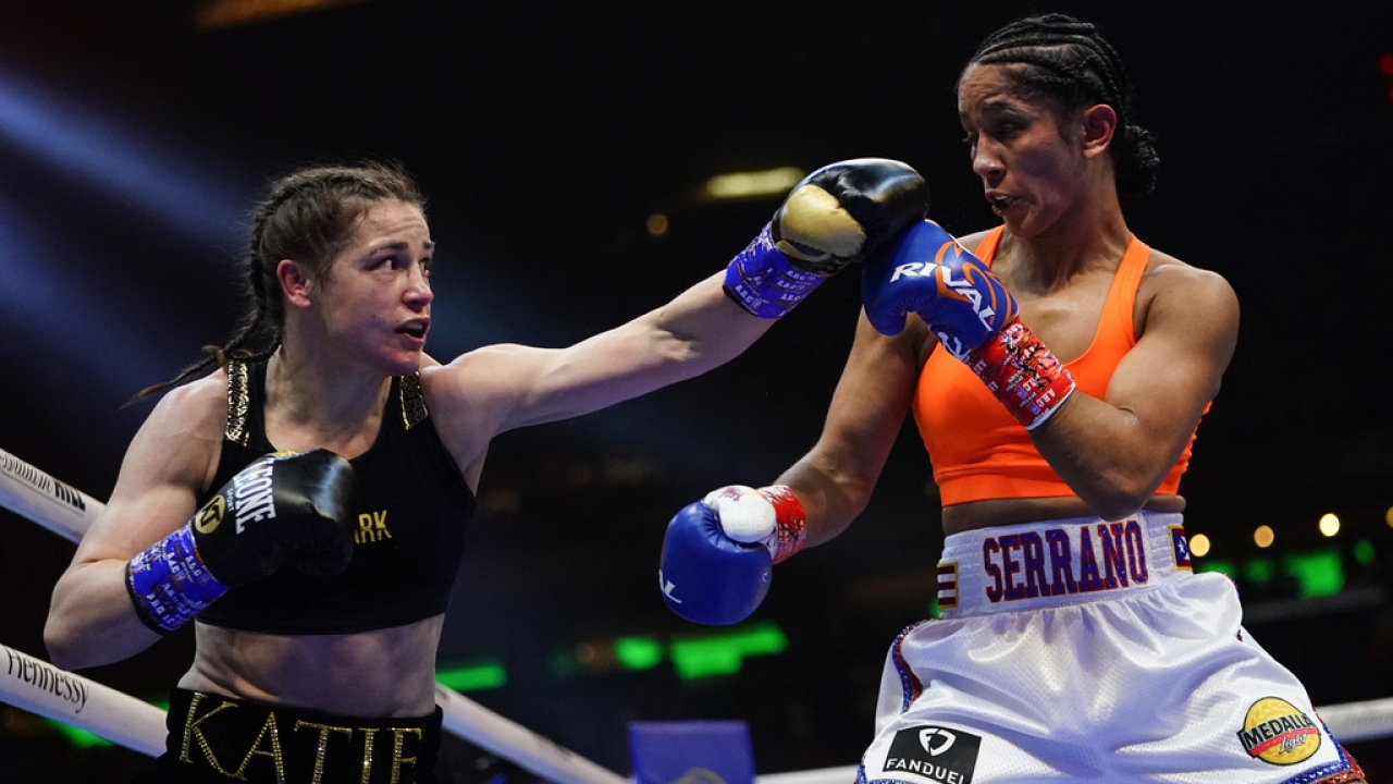 Female boxers compete in the ring