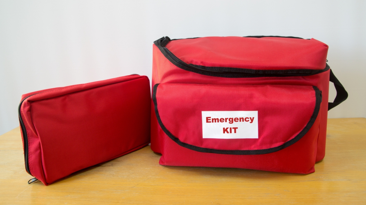 A red bag labeled "Emergency KIT"