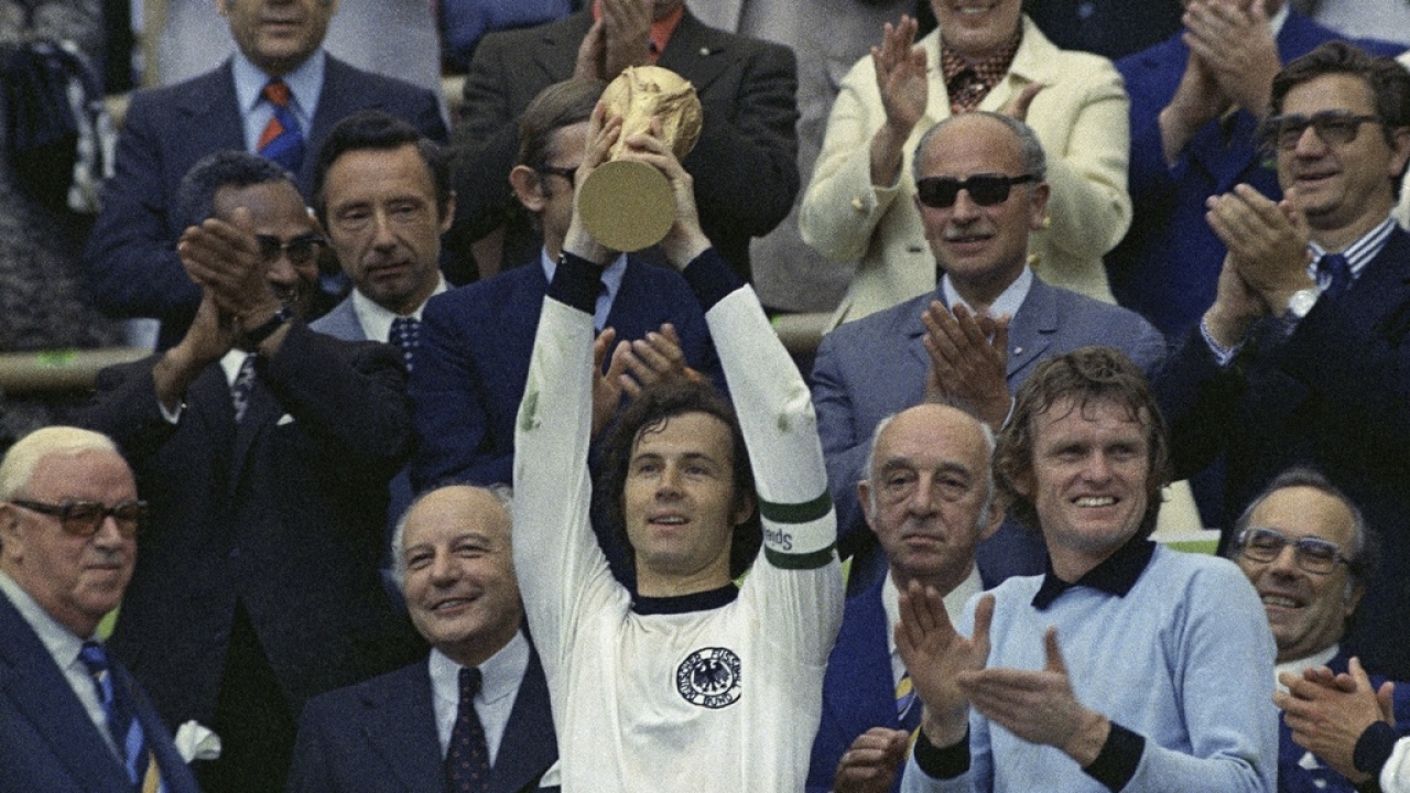 West Germany captain Franz Beckenbauer holds up the World Cup trophy after his team defeated the Netherlands in 1974.